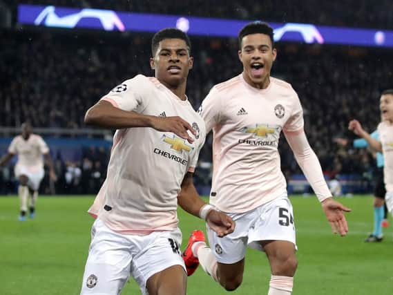 Manchester United's Marcus Rashford celebrates after scoring against Paris Saint-Germain, at the Parc des Princes.