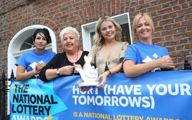 Derry Girl Saoirse Monica Jackson (Erin) visiting National Lottery funded HURT (Have Your Tomorrows) family support group last year with from left, staff members Tina Burns, Sadie O'Reilly and Pauline McCloskey.