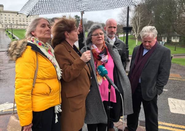 Photo of representatives from campaign group Relatives for Justice speaking outside Stormont House in Belfast following their meeting with  Karen Bradley. Among them are relatives of Sammy Devenney and Stephen McConomy