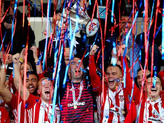 Former Derry City captain, Gerard Doherty lifts the EA Sports Cup trophy at Brandywell last season.