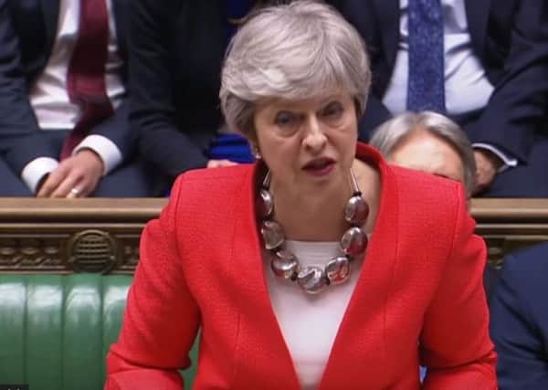 Theresa May speaking in the House of Parliament on Tuesday night.