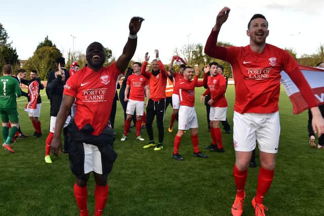Fuad Sule and Shane McEleney celebrate Larne's title victory at Inver Park.