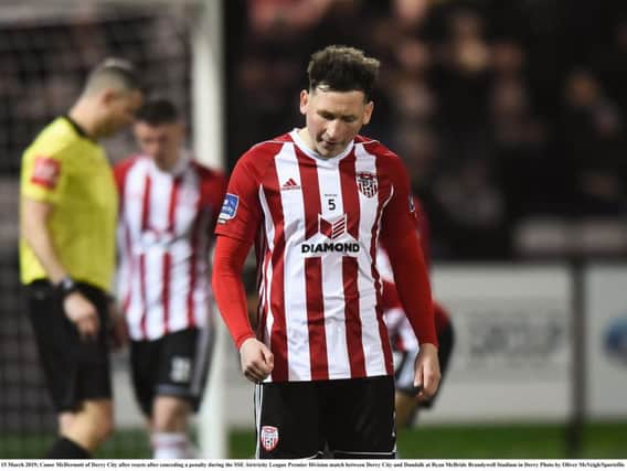 Conor McDermott reacts when Ben Connolly points to the penalty spot in the second half.