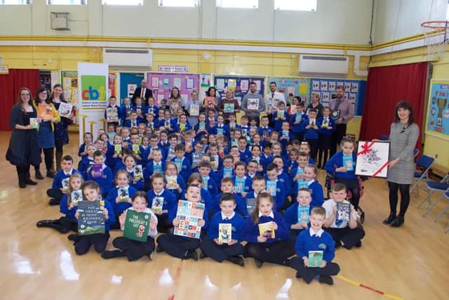 LIBRARIES 2019 AWARD FOR ST. PAULâ¬"S! . . . .Mr. Gareth Blackery, Principal, St. Paulâ¬"s Primary School pictured with his staff and pupils this week after receiving the Childrenâ¬"s Book Ireland award from Ms. Elaine Ryan, Director, Childrenâ¬"s Books Ireland. On right is Mrs. Roisin Logue, Literacy Co-Ordinator, who championed the process from the outset.