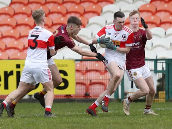 St Patrick's Brandon Boyd and Ruari O'Hare try to stop Conor Mc Laughlin and Naoise O Mainain of Cathair Dhoire during Monday's Mac Larnon Cup final in Armagh