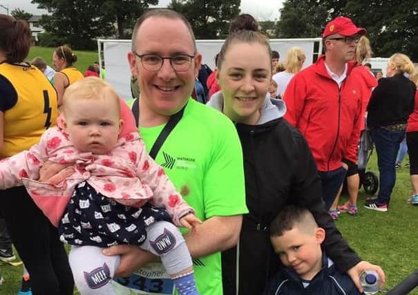 Fr Chris pictured at the finish line of the Waterside Half Marathon with his sister Sarah, nephew Jake and niece Lily Rose.