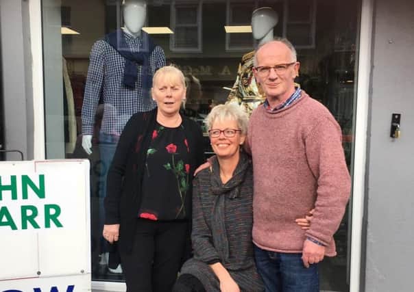 John, Afke and Dolores, pictured outside the new shop.