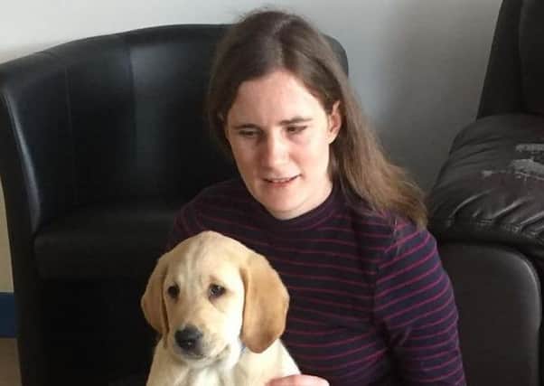 Jennifer, pictured with OJ the puppy.
