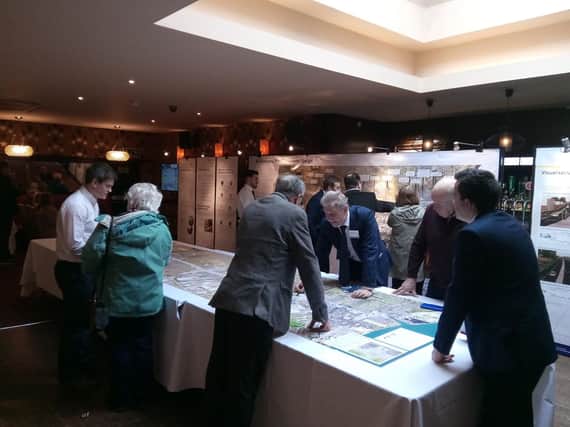 Gordon Noble, DfI project manager on the A2 scheme (centre) discussing the revised plans in Derry on Tuesday.