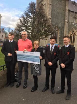 Eileen Best, Director of Operations First Housing, and Gerry Burns, Manager of Damien House, pictured along with Jackson Gallagher, Jack Gallagher and Owen McGeehan from St. Josephs Boys School.