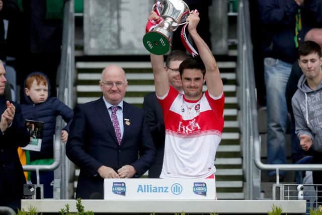 Derry captain Christopher McKaigue lifts the Division Four trophy after their victory over Leitrim in Croke Park.