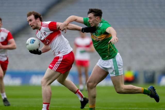 Padraig Casey gets away from Leitrim's Dean McGovern  in Croke Park.