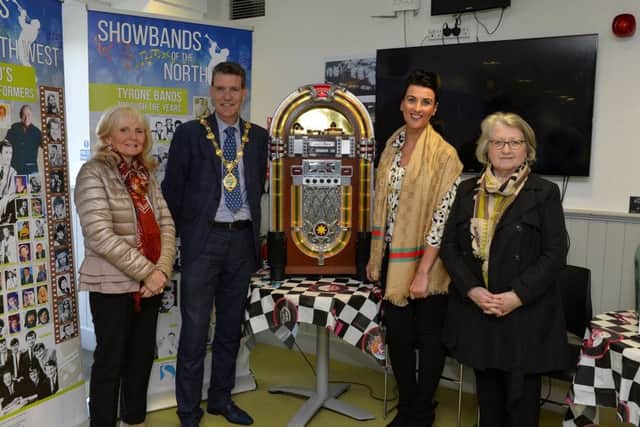 Sally Kennedy, on the left, Gillian Quigley and Catherine Moore pictured recently with Councillor John Boyle, Mayor of Derry City and Strabane, at the  launch the Showbands of the North West exhibition at Aras Cholmcille Heritage Centre.  DER1319GS-046