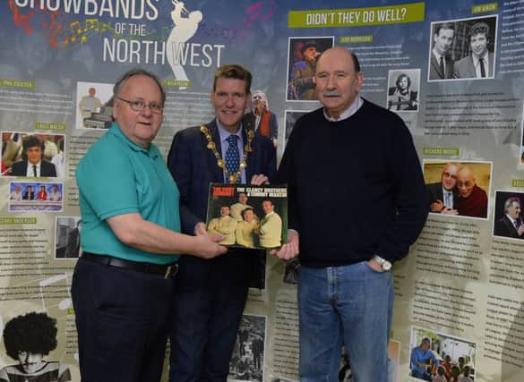 Ivor  Doherty, on the left, and Johnny Moore, exhibition creator, pictured with Councillor John Boyle, Mayor of Derry City and Strabane at the recent launch the Showbands of the North West exhibition in Aras Cholmcille Heritage Centre.  DER1319GS-048