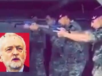 Soldiers from the British Parachute Regiment pictured using a large image of Labour party leader, Jeremy Corbyn.
