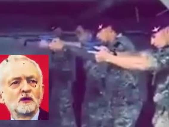 Soldiers from the British Parachute Regiment pictured using a large image of Labour party leader, Jeremy Corbyn.