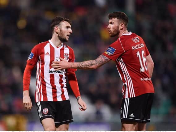 amie McDonagh of Derry City, left, is ushered from the field by team-mate Patrick McClean after being sent off in Tallaght.