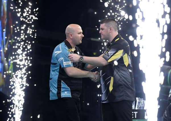 Rob Cross with Daryl Gurney during the Unibet Premier League Darts at the SSE Arena, Belfast