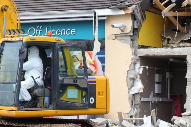 The scene at O'Kane's filling station outside Dungiven, Co. Derry, where an ATM was stolen with the aid of a digger in the early hours of Sunday morning.