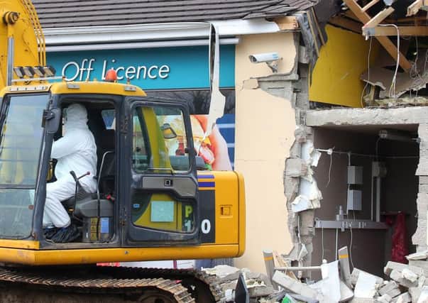 The scene at O'Kane's filling station outside Dungiven, Co. Derry, where an ATM was stolen with the aid of a digger in the early hours of Sunday morning.