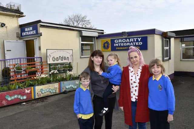 Pictured at Groarty Integrated Primary School, which is facing closure, are from left, Haiden McLaughlin, Diana McLaughlin, Arianna McLaughlin, Leanne Brown and Oisin Brown. DER1519-131KM