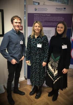 Oonagh McAllister (centre), Peace Bytes Co-ordinator pictured with Harley and Charlotte particpants on the programme at an event in Brussels