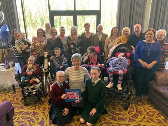 Dr Heather McCluggage pictured with some of her former patients and their carers at a special afternoon tea in the Everglades Hotel to mark her retiremen after two decades as paediatric palliative care consultant