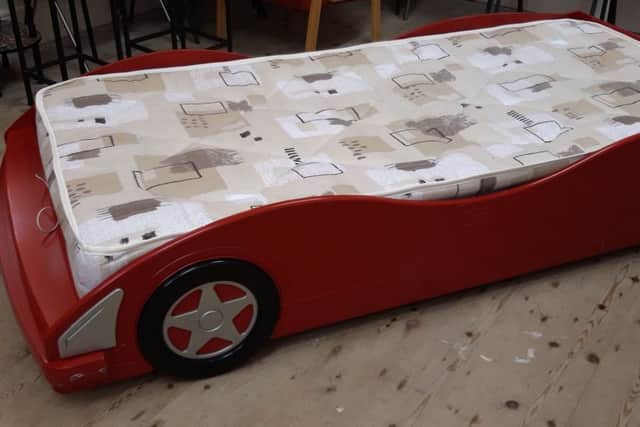 A young car enthusiast would like this bed.