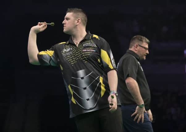 Daryl Gurney in action against James Wade.