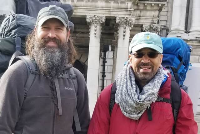 Derry bound Ken Johnston and Daniel Shipp at the start of their walk at Belfast City Hall.