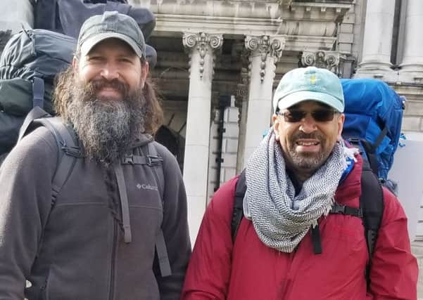 Derry bound Ken Johnston and Daniel Shipp at the start of their walk at Belfast City Hall.