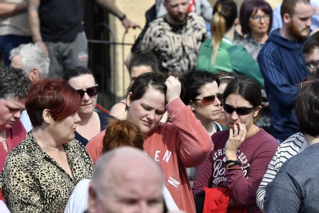 Lyra McKee's partner Sara Canning with friends at the vigil in Creggan on Friday.