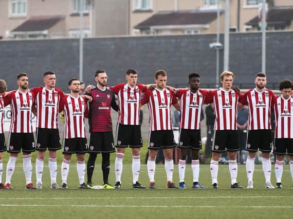 Derry City players honour a minute's silence for journalist Lyra McKee who was murdered in Creggan, on Thursday night.