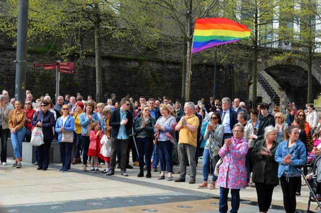 People applaud at the 1pm vigil for Lyra McKee, in Guildhall Square, to express solidarity as her funeral takes place in Belfast.  DER1719GS-039