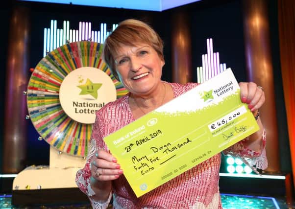 Mary Doran from Newtowncunningham, Co. Donegal has won 45,000 on last Saturday's  Winning Streak Game Show on RTE. Michael Hayes Head of Marketing at the National Lottery presented her with her winning cheque shortly after the show. Pic: Mac Innes Photography