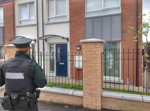 Police at the scene of the house in Derrymore this morning.