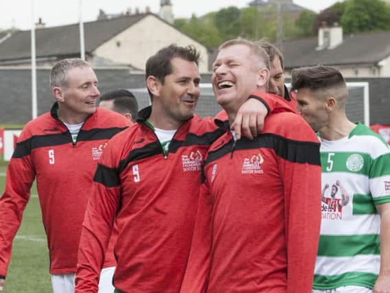 Celtic players share a joke as they leave the pitch during Sunday's Ryan McBride Soccer Sixes.