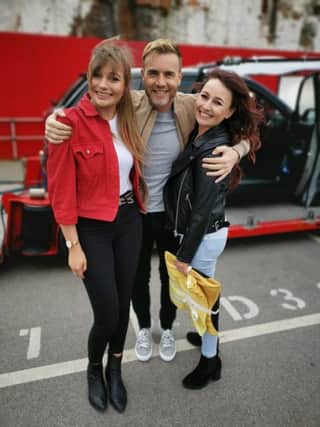 Katie and Lindsay Abbot, from Limavady, pictured with Take That frontman Gary Barlow.