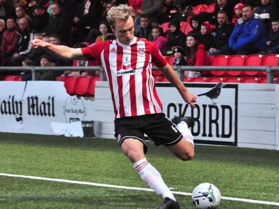 Derry City midfielder, Gregg Sloggett crosses for Junior Ogedi-Uzokwe in the second half.