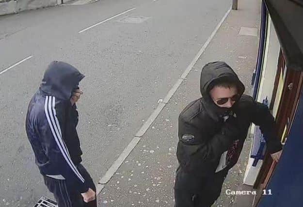 The two culprits captured on CCTV.
