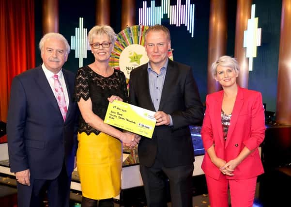 Afke Barr from Buncrana won 37,000 euro,  including a car on last Saturday's ( Winning Streak Game Show on RTE. Pictured here at the presentation of the winners cheques were from left to right: Marty Whelan, Winning Streak game show co-host; Afke Barr the winning recipient; Dermot Griffin, Chief Executive of the National Lottery and Sinead Kennedy, Winning Streak Game Show co-host. The winning ticket was bought from Bradley's Shop, Gort, Fahan.. Pic: Mac Innes Photography