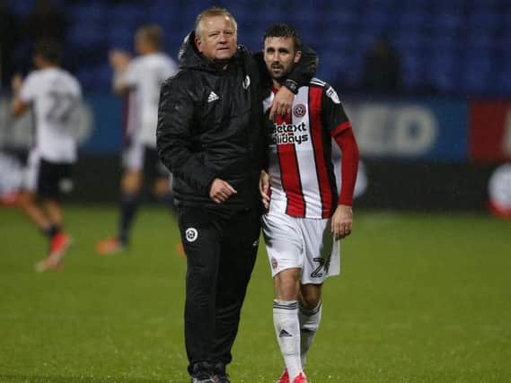 Danny Lafferty is embraced by Sheffield United manager, Chris Wilder.
