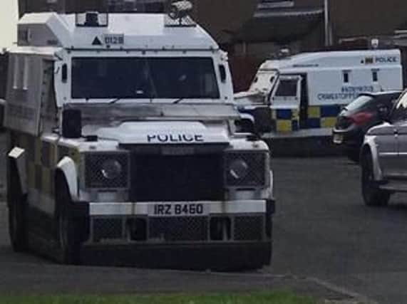 An image of police Land Rovers as raids were carried out in Derry this morning.