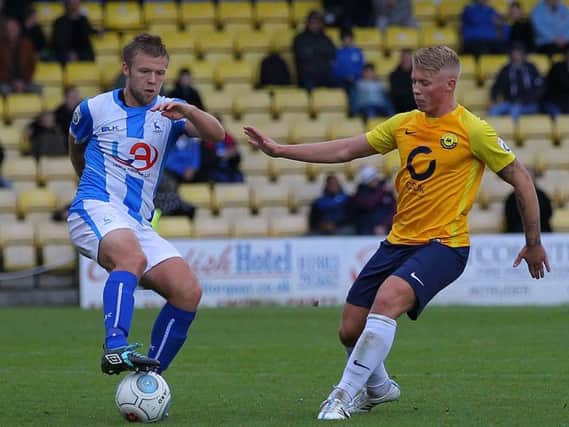 George Dowling (right) pictured playing for Torquay United against Hartlepool United in the Vanarama National League in 2017, is currently on trial at Derry City.