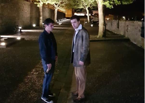 Actors Kevin Nugent (Frankie) and James McKenzie (Tony) on the Derry Walls.