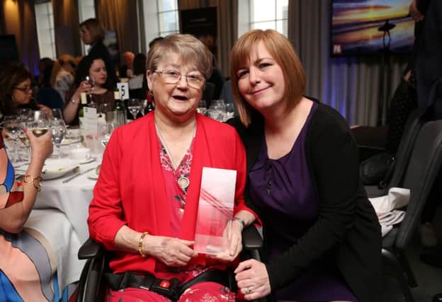 Joan McKee and Nichola Corner, receiving a posthumous award for Lyra McKee's commitment and contribution to journalism from the Journalists' Charity.