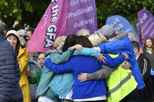 Some of the participants embrace after completing Lyra's Walk.
