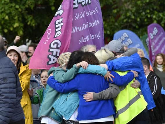 Some of the participants embrace after completing Lyra's Walk.