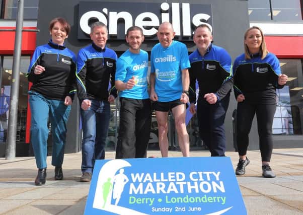 Orla Ward, Development Manager, O'Neills, Noel McMonagle, Race Director, local runners Tommy McCallion and Tommy Hughes, Scott Galbraith, Event Director, and Caroline Casey, O'Neills store manager, Derry.