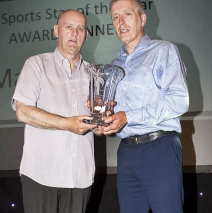SPORTS STAR OF THE YEAR. . . .The DCSDC 2018-19 Sports Star of the Year Mark Connolly accepting the award from Ian Harkin, during Thursday nightâ¬"s Derry City and Strabane District Councilâ¬"s Annual Sports Awards at the Fir Trees Hotel, Strabane on Thursday night. (Photo: Jim McCafferty Photography)